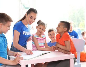 young volunteer with children
