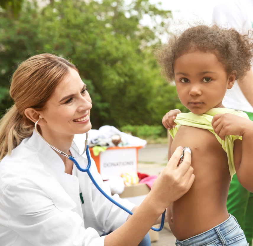 woman checking a little girl